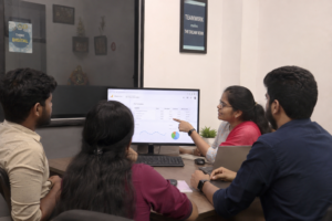 digital marketing services team meeting Coimbatore office reviewing campaign strategy 2026